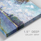 Close-up view of wrapped canvas corner featuring river landscape with boats.