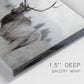 Close-up view of wrapped canvas corner featuring elk standing in open grassland.