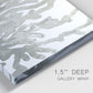 Close-up view of wrapped canvas corner featuring monochrome coral texture study.
