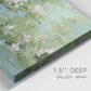 Close-up view of wrapped canvas corner featuring soft green water lilies.