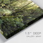 Close-up view of wrapped canvas corner featuring sun filtered woodland photograph.