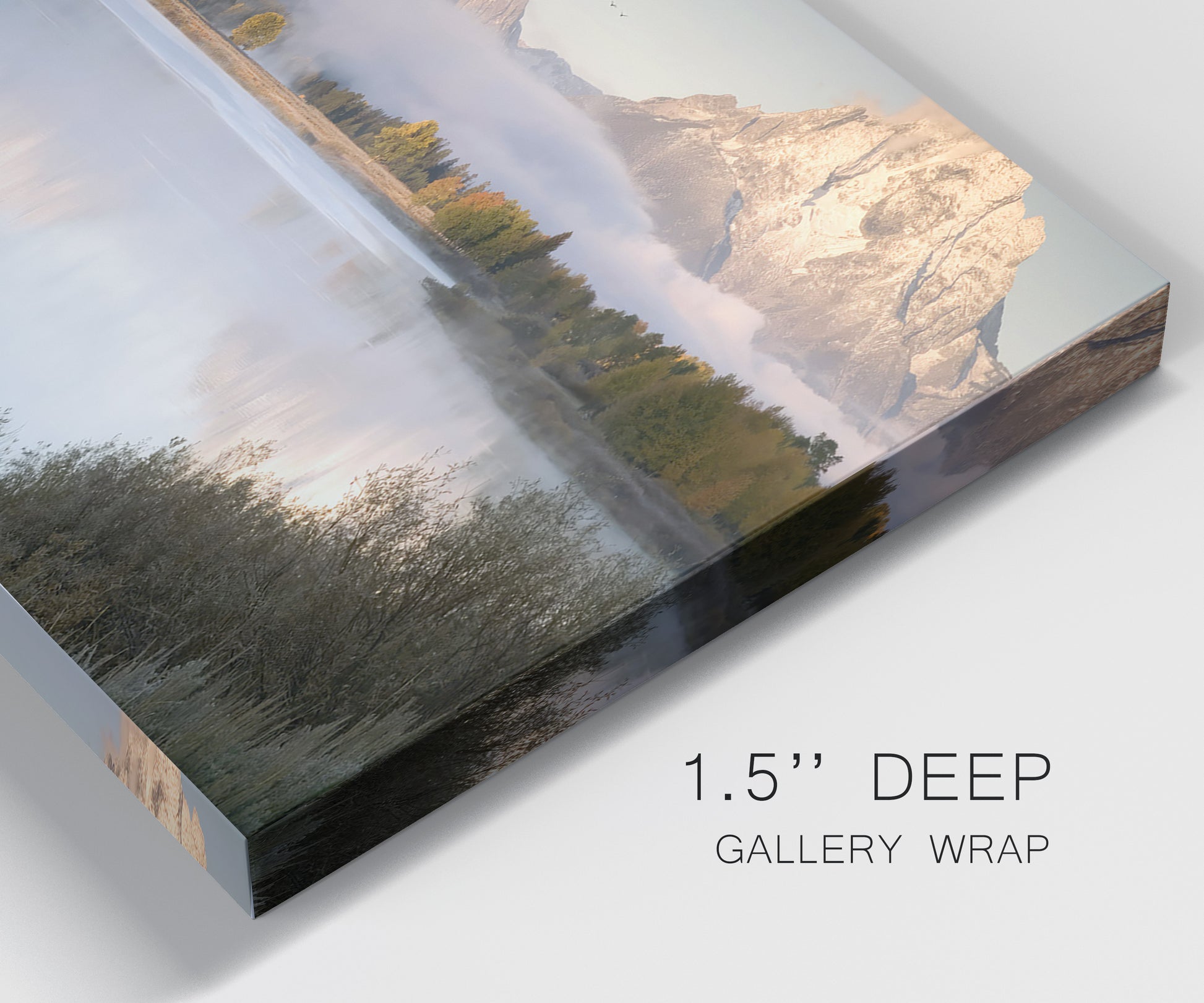Close-up view of wrapped canvas corner featuring fog drifting over winding river.