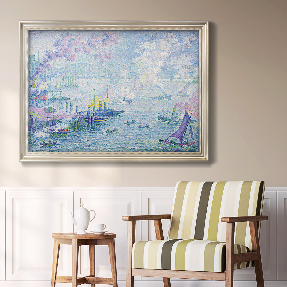 Impressionist industrial harbor scene by Paul Signac in an ornate champagne frame displayed in a light-toned interior setting.