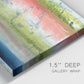 Close-up view of wrapped canvas corner featuring layered abstract color banding.