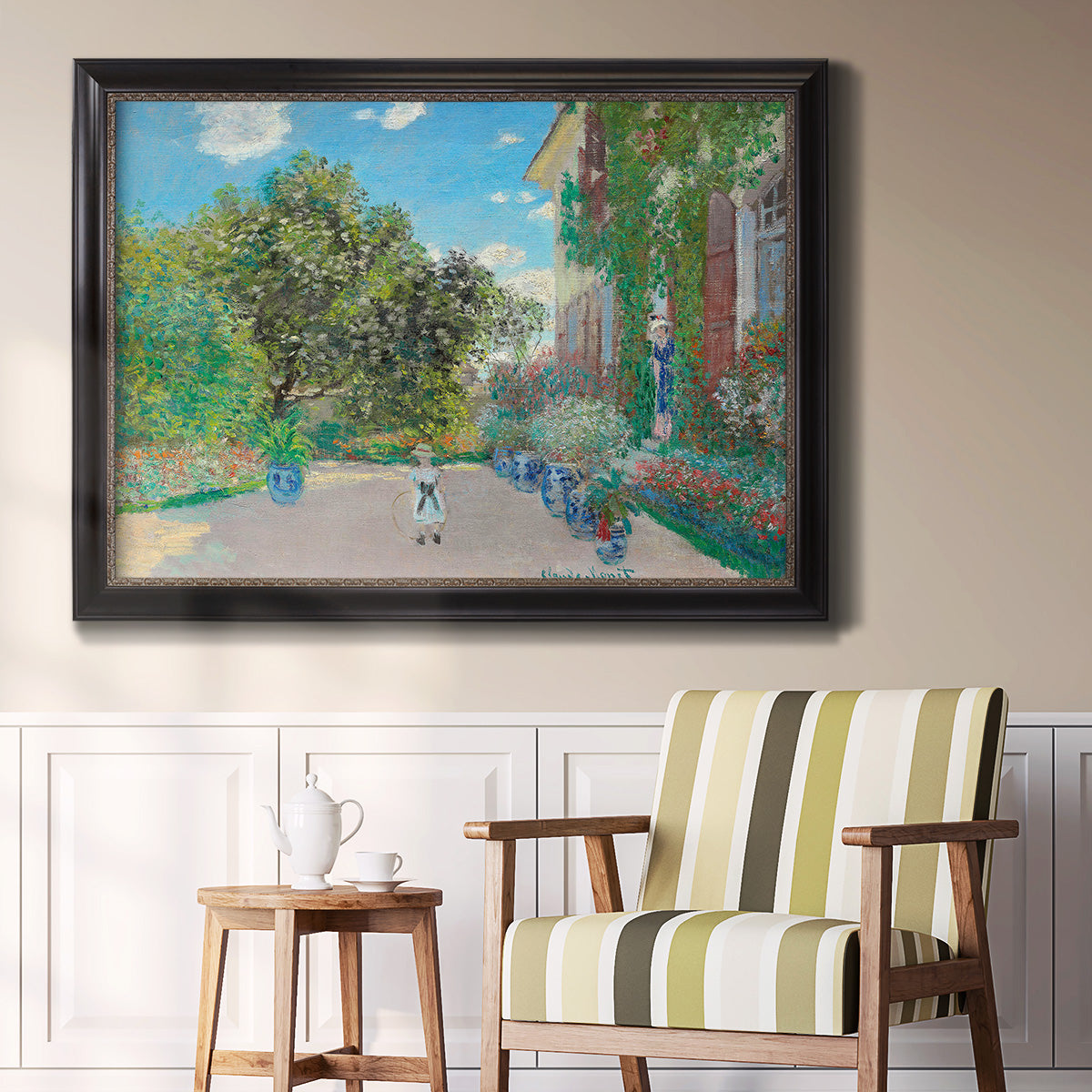 Impressionist residential landscape at Argenteuil by Claude Monet in an ornate black frame with gilded inner detail displayed in a light-toned interior setting.