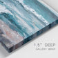 Close-up view of wrapped canvas corner featuring crashing ocean waves along shoreline.