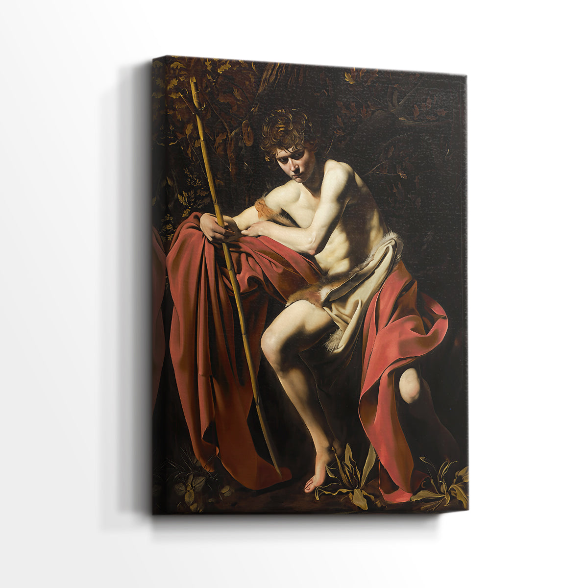 Side view of a canvas art print of a religious figure in shadow with soft highlights, showing gallery-wrapped depth.