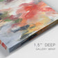 Close-up view of wrapped canvas corner featuring abstract floral color composition.