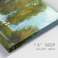 Close-up view of wrapped canvas corner featuring tall trees lining open landscape.