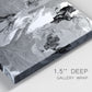 Close-up view of wrapped canvas corner featuring abstract marble texture composition.