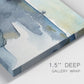 Close-up view of wrapped canvas corner featuring abstract watercolor with upward motion.
