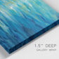 Close-up view of wrapped canvas corner featuring deep blue ocean water abstraction.