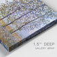 Close-up view of wrapped canvas corner featuring three poplar trees beside water.