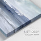 Close-up view of wrapped canvas corner featuring abstract coastal tones and movement.
