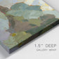 Close-up view of wrapped canvas corner featuring abstract landscape suggesting travel pause.