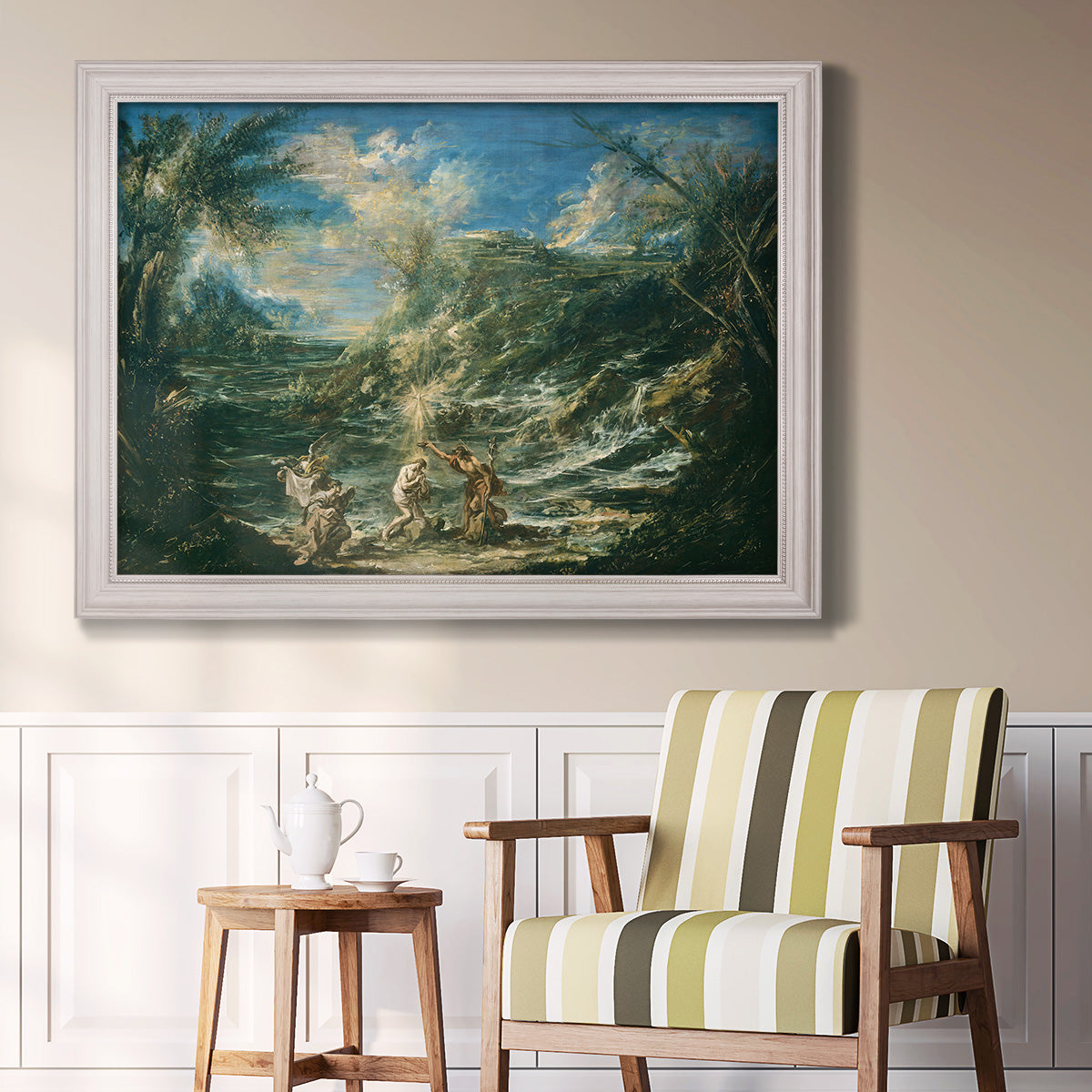 Religious landscape depicting the baptism of Christ by Alessandro Magnasco in an ornate weathered white frame displayed in a light-toned interior setting.