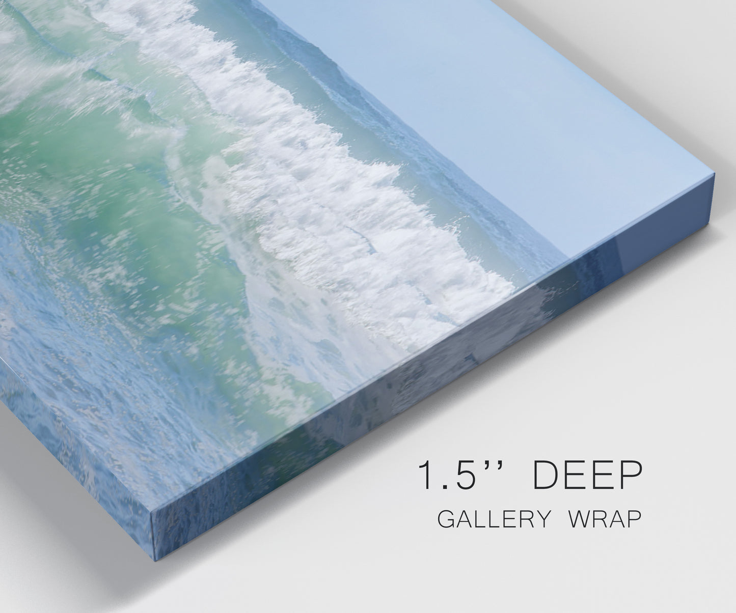 Close-up view of wrapped canvas corner featuring coastal waves breaking ashore.