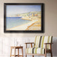 Impressionist Mediterranean jetty seascape by Paul Signac in an ornate black frame with gilded inner detail displayed in a light-toned interior setting.