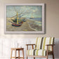 Impressionist coastal fishing boats scene by Vincent van Gogh in an ornate weathered white frame displayed in a light-toned interior setting.