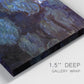 Close-up view of wrapped canvas corner featuring deep blue water lily reflections.