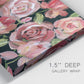 Close-up view of wrapped canvas corner featuring bold red floral abstraction.