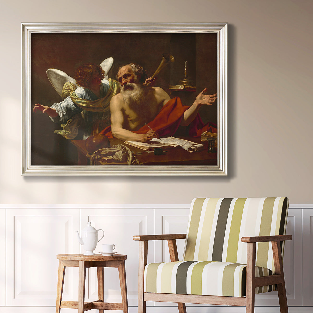 Classical religious painting of Saint Jerome with an angel by Simon Vouet in an ornate champagne frame displayed in a light-toned interior setting.