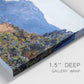 Close-up view of wrapped canvas corner featuring winding coastal road above sea.