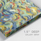 Close-up view of wrapped canvas corner featuring colorful abstract river like motion.
