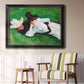Impressionist outdoor portrait of two girls by John Singer Sargent in an ornate black frame with gilded inner detail displayed in a light-toned interior setting.