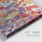 Close-up view of wrapped canvas corner featuring colorful floral arrangement.