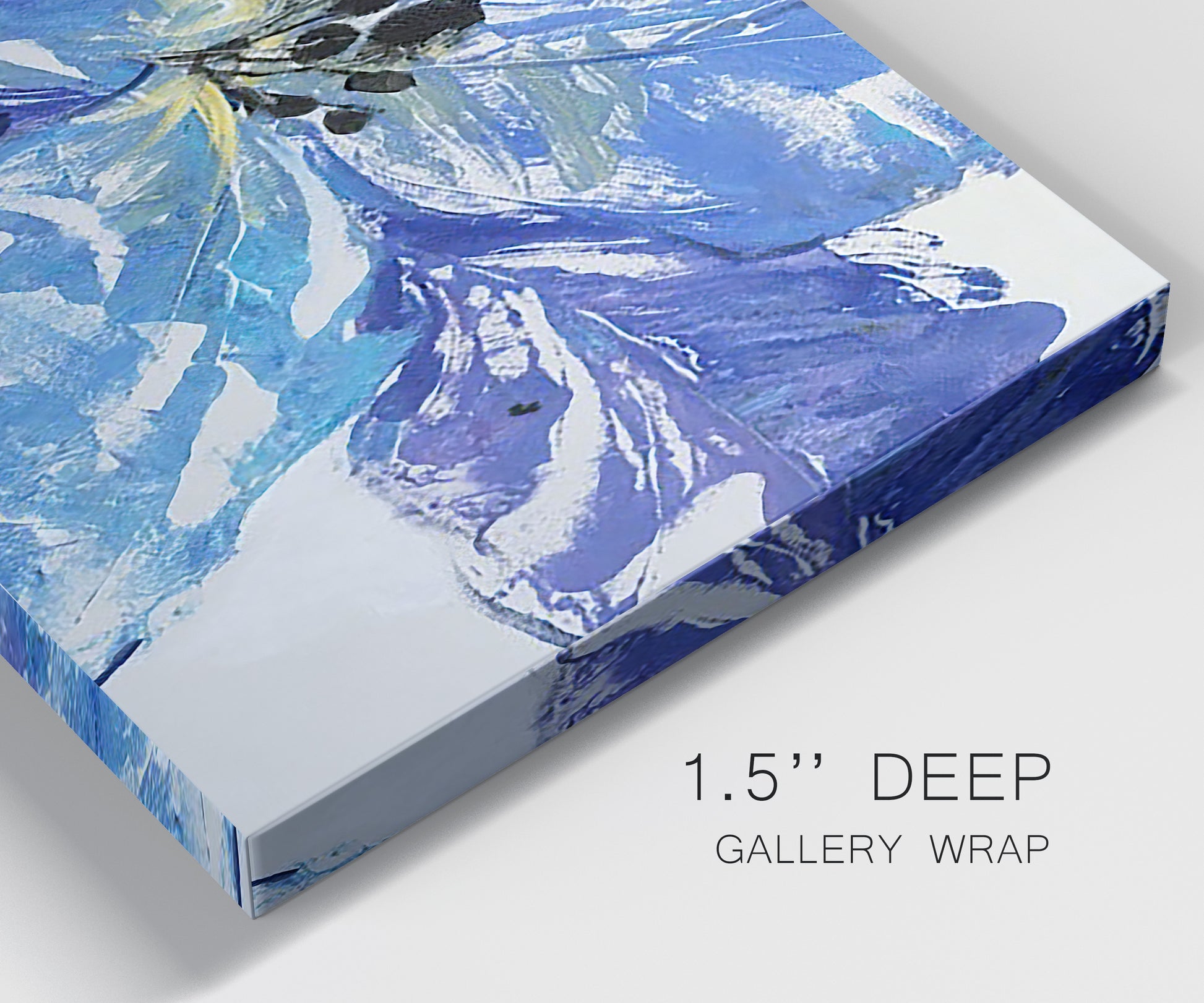 Close-up view of wrapped canvas corner featuring blue floral botanical close up.
