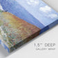 Close-up view of wrapped canvas corner featuring coastal path leading to sea.