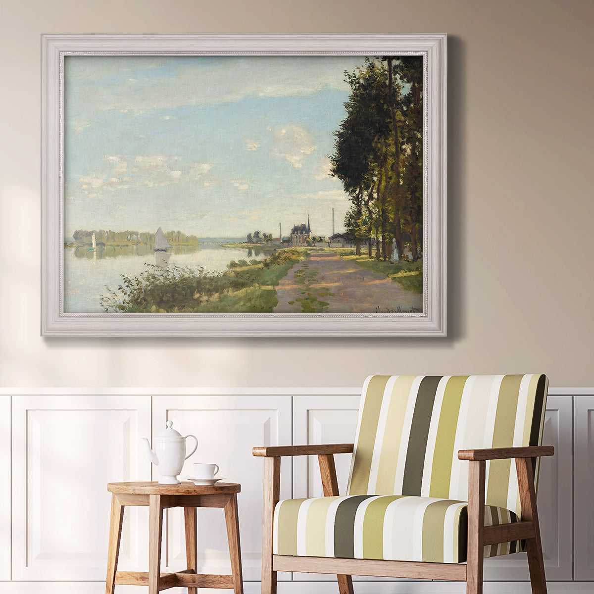 Impressionist river scene with red boats by Claude Monet in an ornate weathered white frame displayed in a light-toned interior setting.