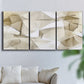 Three-panel canvas wall art featuring soft abstract meditative color balance, displayed in a living room above a sofa.