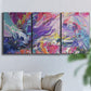 Three-panel canvas wall art featuring expressive abstract with layered color, displayed in a living room above a sofa.