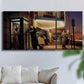 Three-panel canvas wall art featuring cinematic nighttime theater scene, displayed in a living room above a sofa.
