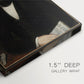 Close-up of a gallery-wrapped canvas corner showing a dignified figure with gentle contrast, highlighting texture and print detail.
