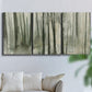 Three-panel canvas wall art featuring wooded forest path watercolor, displayed in a living room above a sofa.