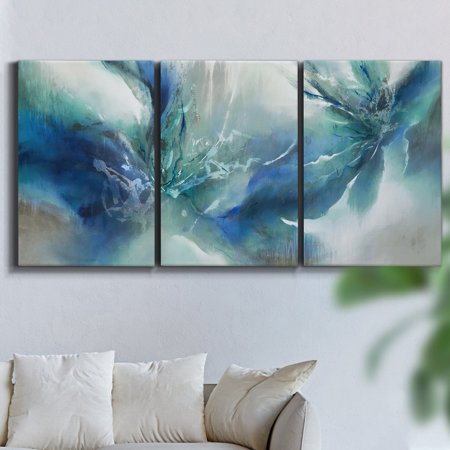 Three-panel canvas wall art featuring subtle abstract light flicker composition, displayed in a living room above a sofa.