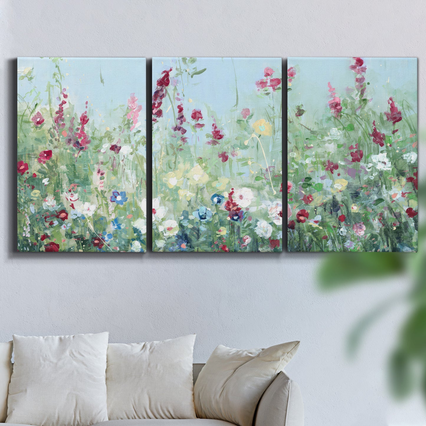 Three-panel canvas wall art featuring night landscape silhouette photography, displayed in a living room above a sofa.
