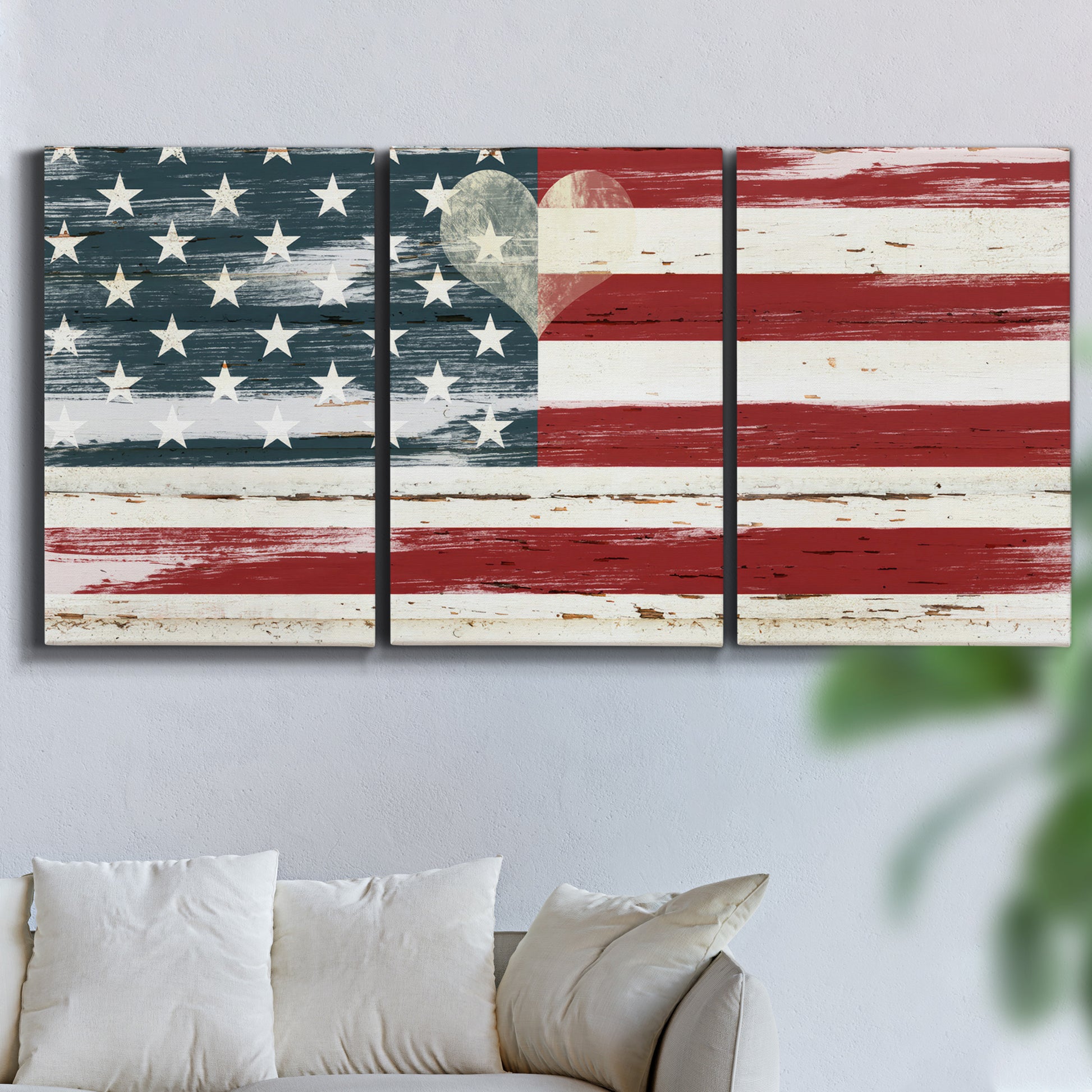 Three-panel canvas wall art featuring rustic american flag country style, displayed in a living room above a sofa.
