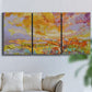 Three-panel canvas wall art featuring abstract meadow inspired color fields, displayed in a living room above a sofa.