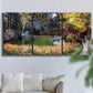 Three-panel canvas wall art featuring garden in full bloom by coast, displayed in a living room above a sofa.