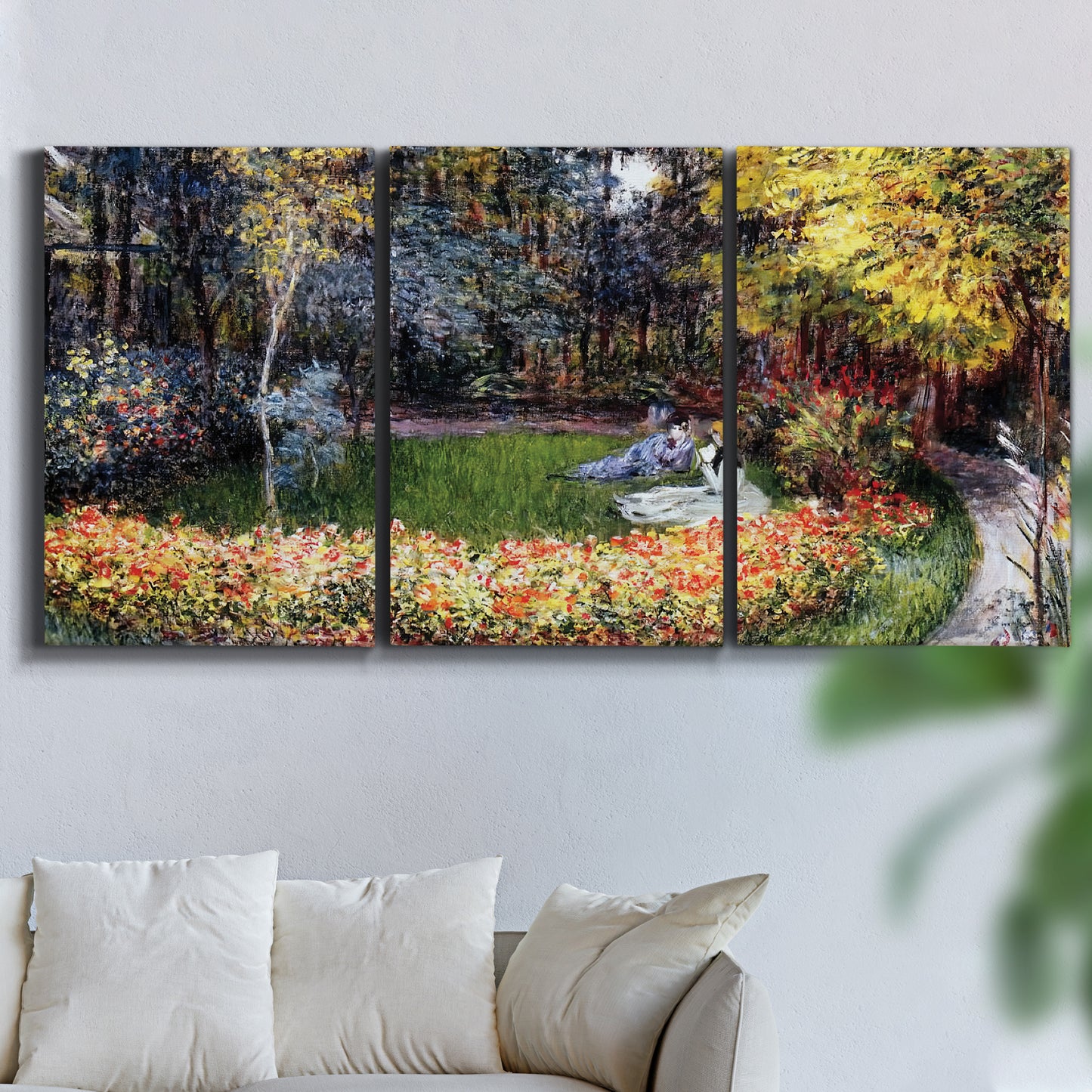 Three-panel canvas wall art featuring garden in full bloom by coast, displayed in a living room above a sofa.