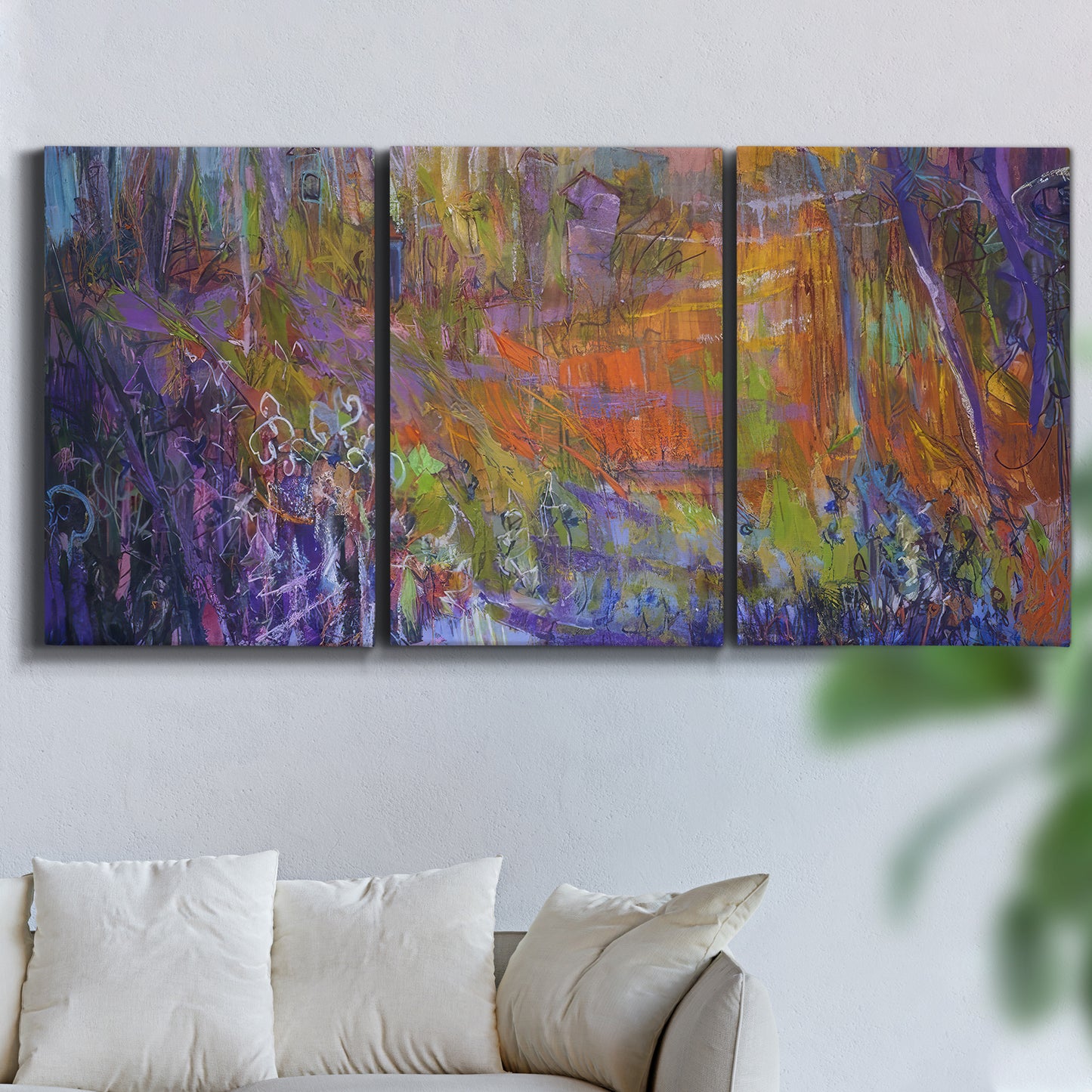 Three-panel canvas wall art featuring abstract rainfall with butterfly forms, displayed in a living room above a sofa.