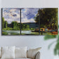 Three-panel canvas wall art featuring riverbank landscape near village, displayed in a living room above a sofa.