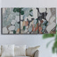 Three-panel canvas wall art featuring layered canyon inspired abstract forms, displayed in a living room above a sofa.