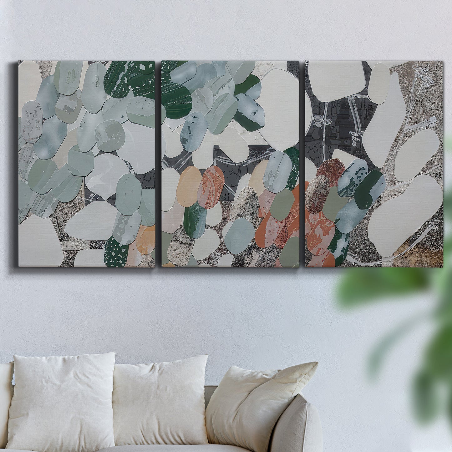Three-panel canvas wall art featuring layered canyon inspired abstract forms, displayed in a living room above a sofa.