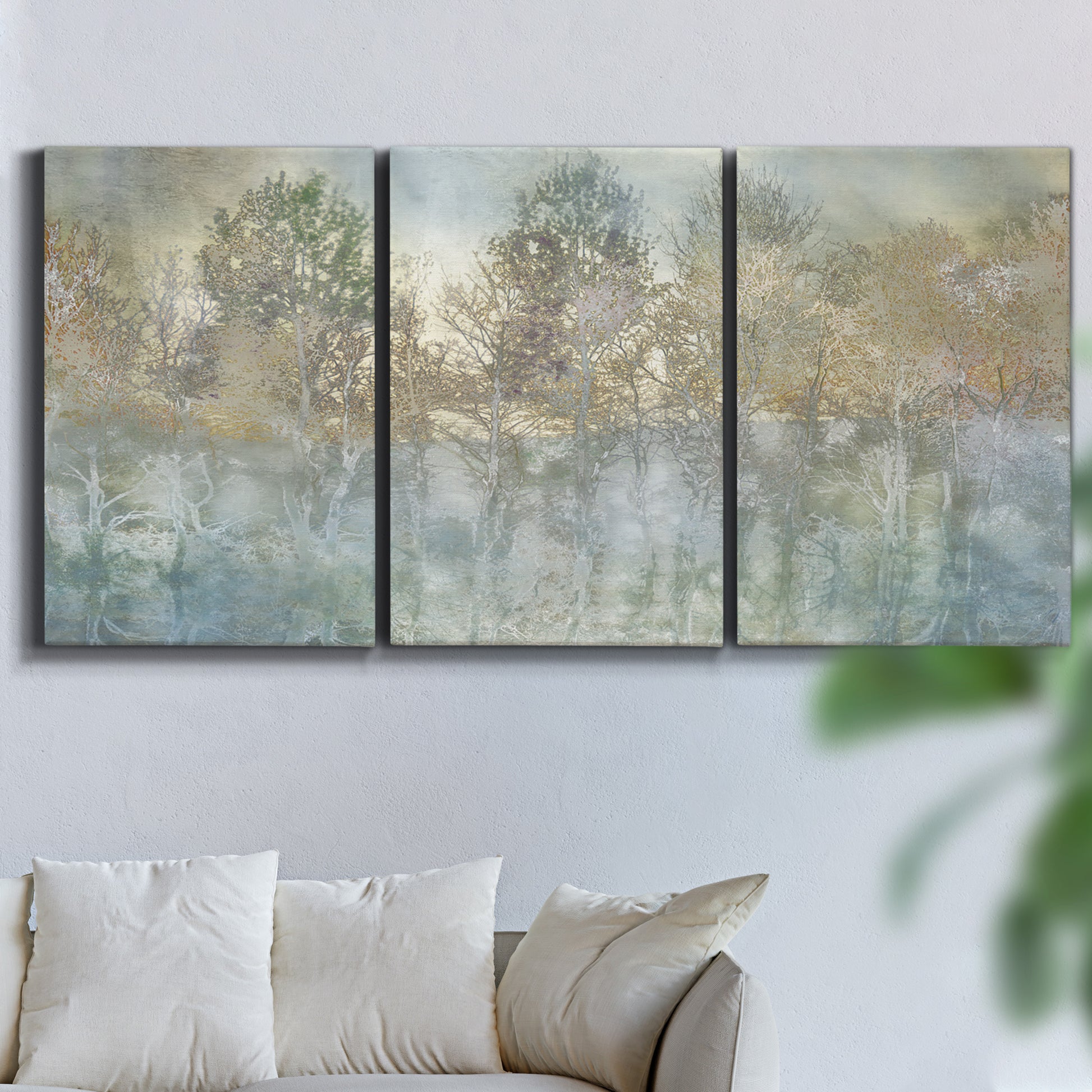 Three-panel canvas wall art featuring abstract river reflections, displayed in a living room above a sofa.