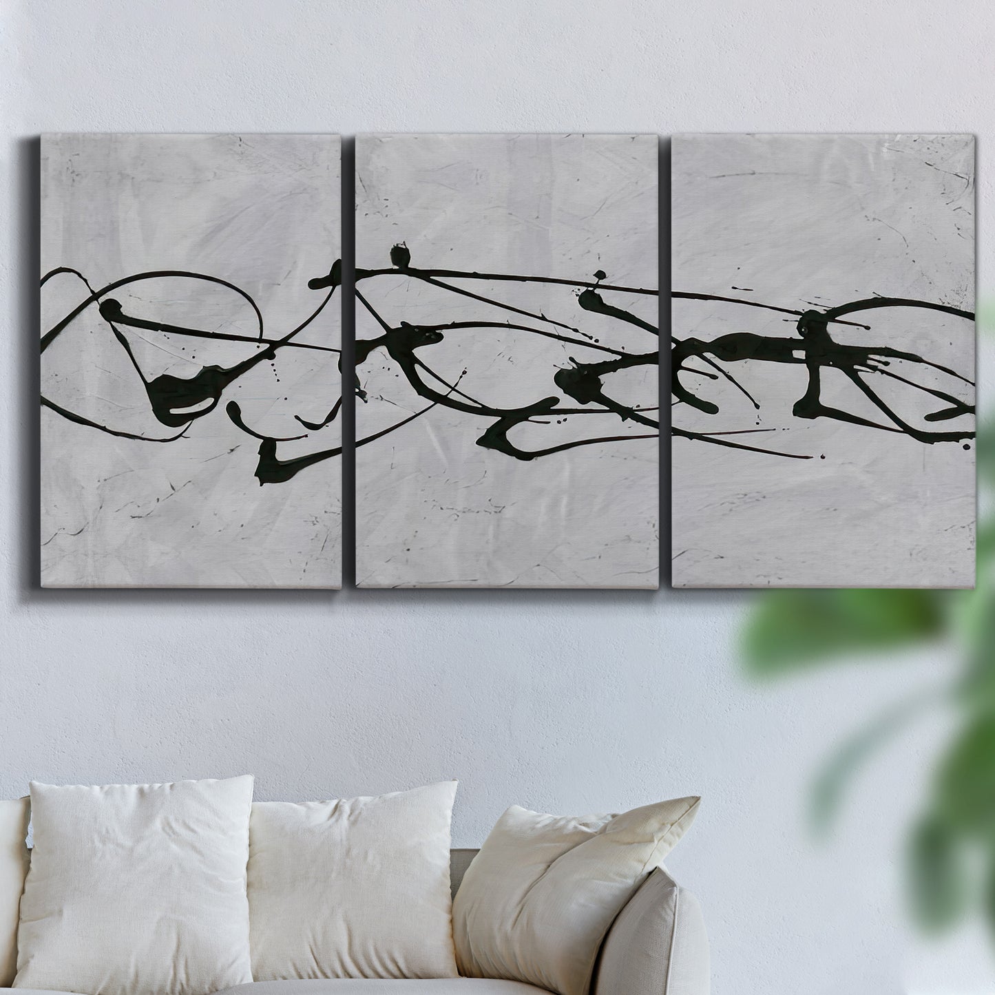 Three-panel canvas wall art featuring minimal abstract frequency lines, displayed in a living room above a sofa.